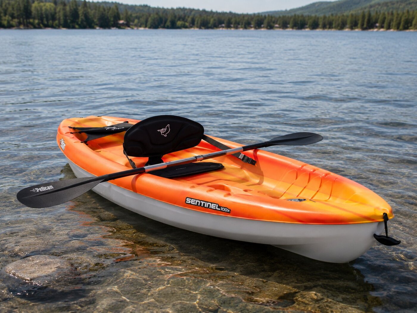 Gray — Pelican Sentinel 100X sit-on-top kayak at the water's edge